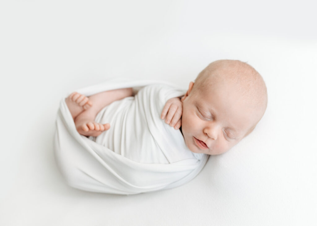 swaddled newborn by Atlanta Newborn Photographer Lisa Lefevre