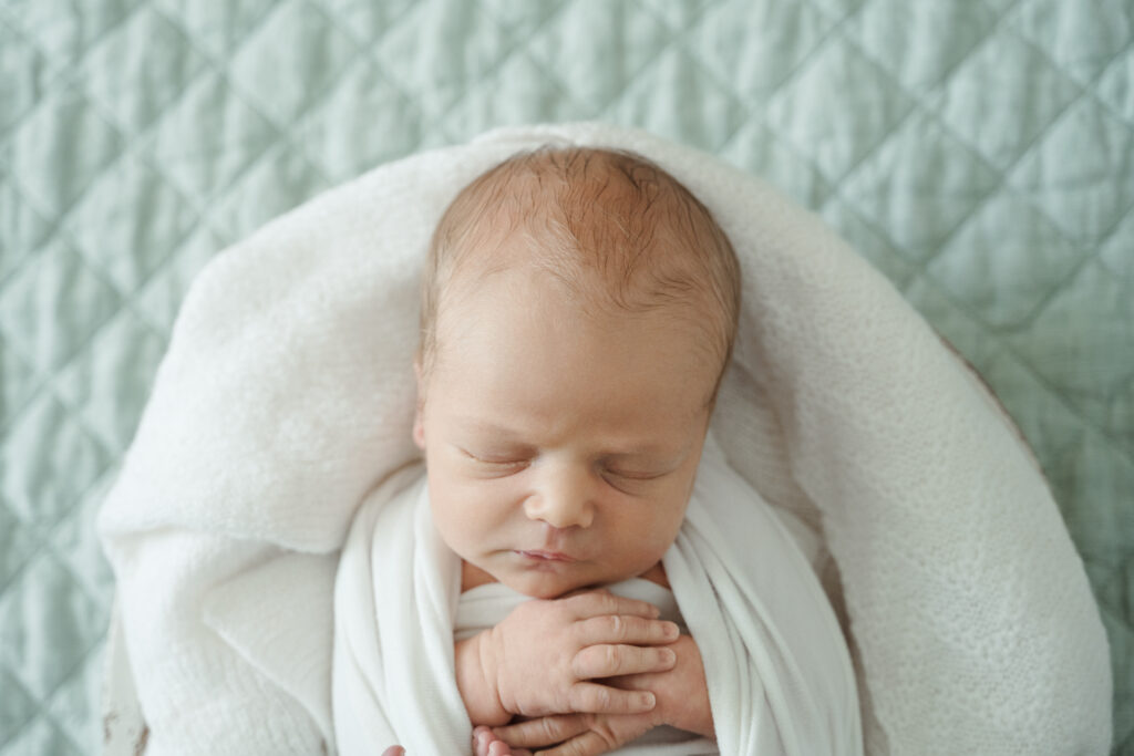 newborn wrapped in photo session