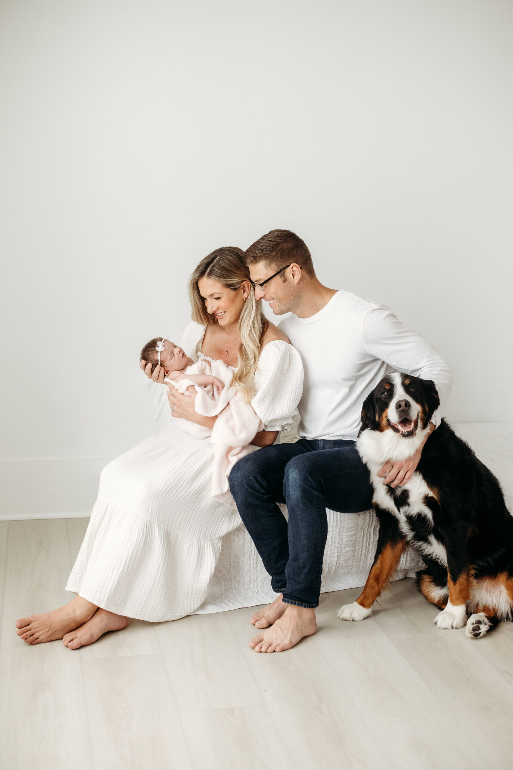 family with new baby and dog at newborn session
